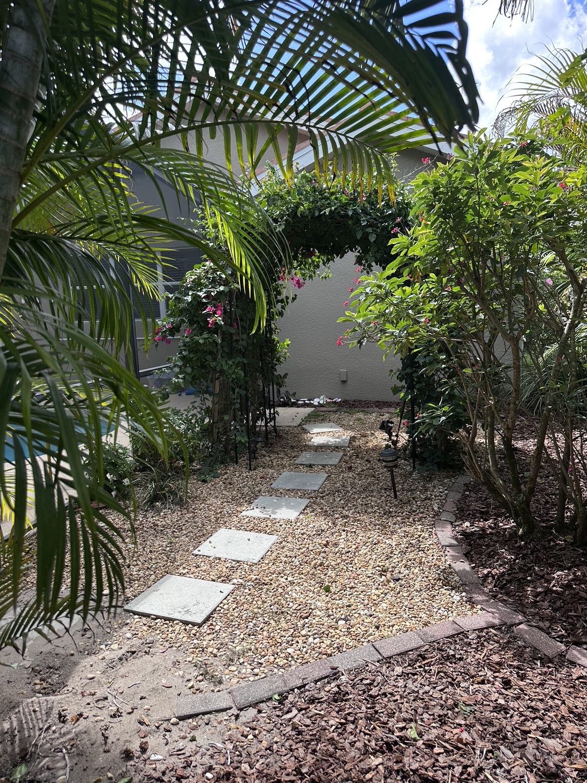 Palm-lined stepping-stone garden path