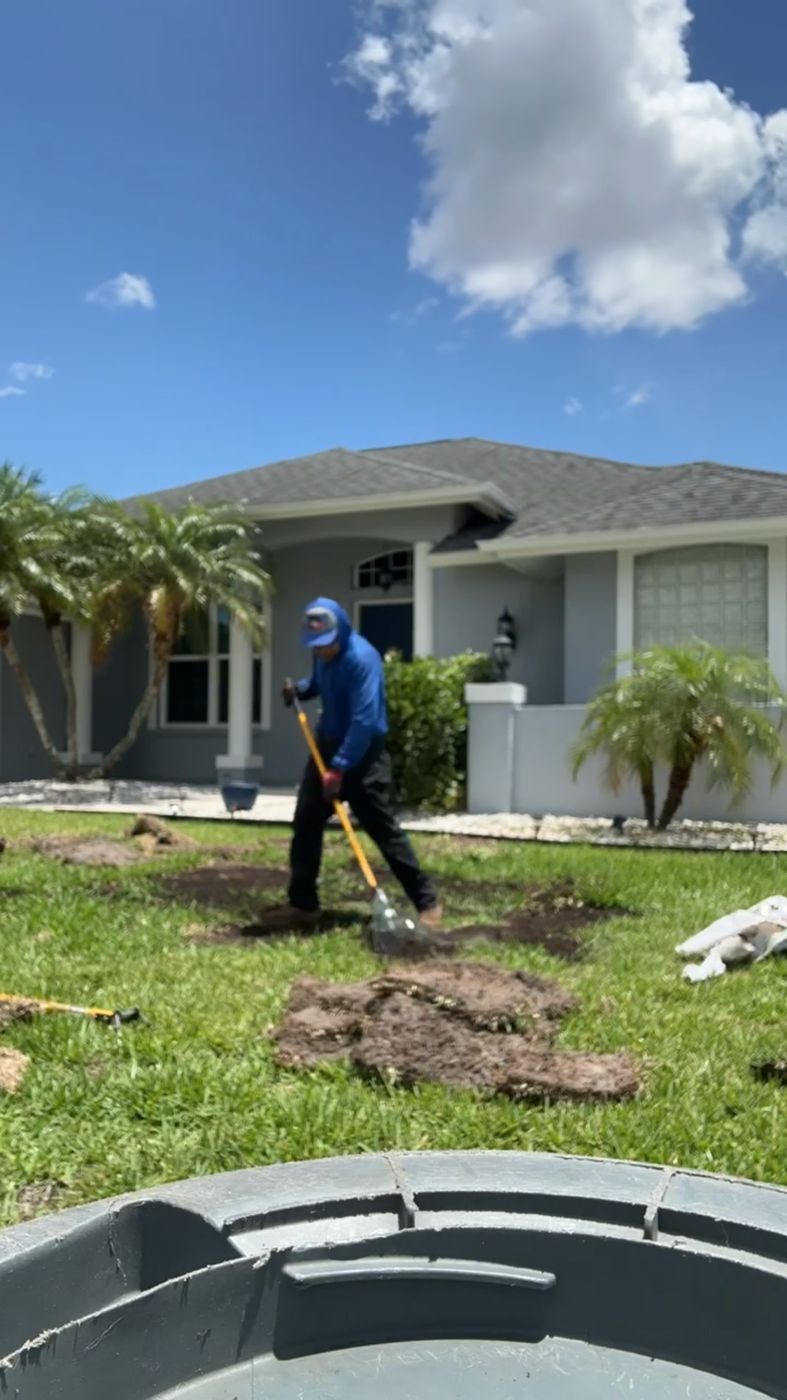 Wolseley Rivera digging a planting hole in a front yard